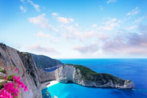 Navagio beach rocks, famous overhead lanscape of Zakinthos island, Greece with flowers